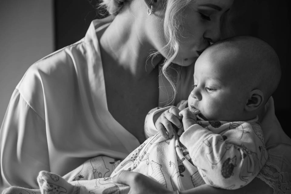 Bride kisses her sweet baby