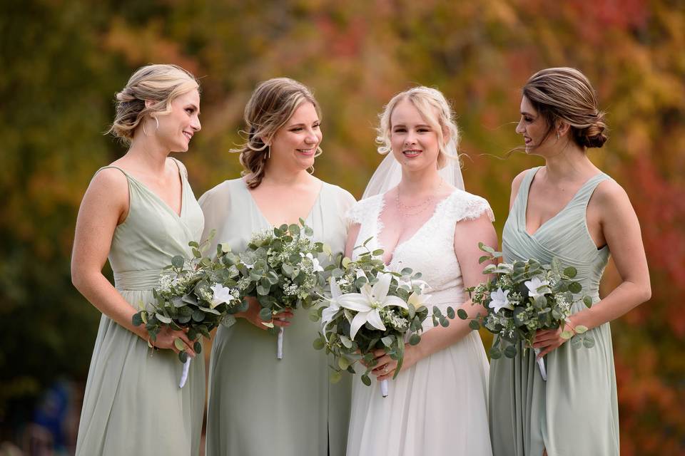 Bridesmaids admire bride