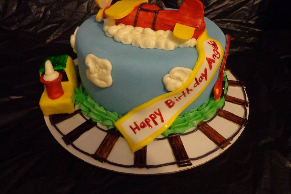 Airplane, Train, And Car Themed Birthday Cake