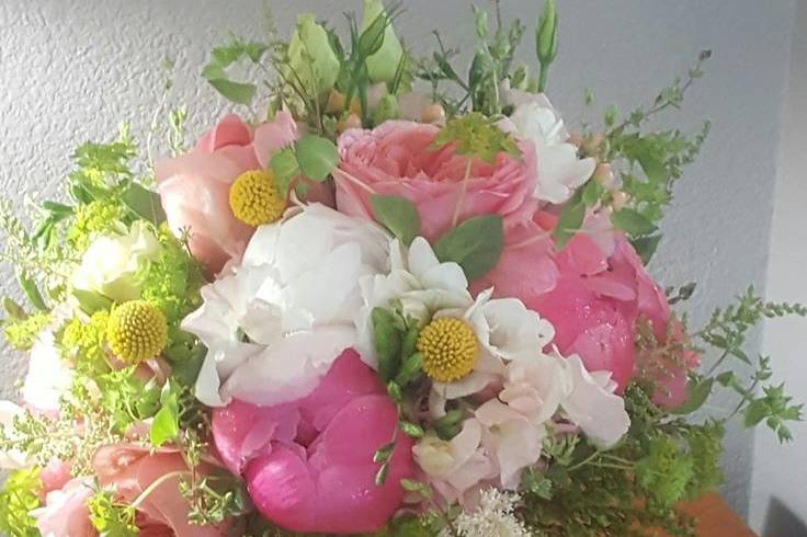 Pink peonies, garden roses and seasonal summer flowers.