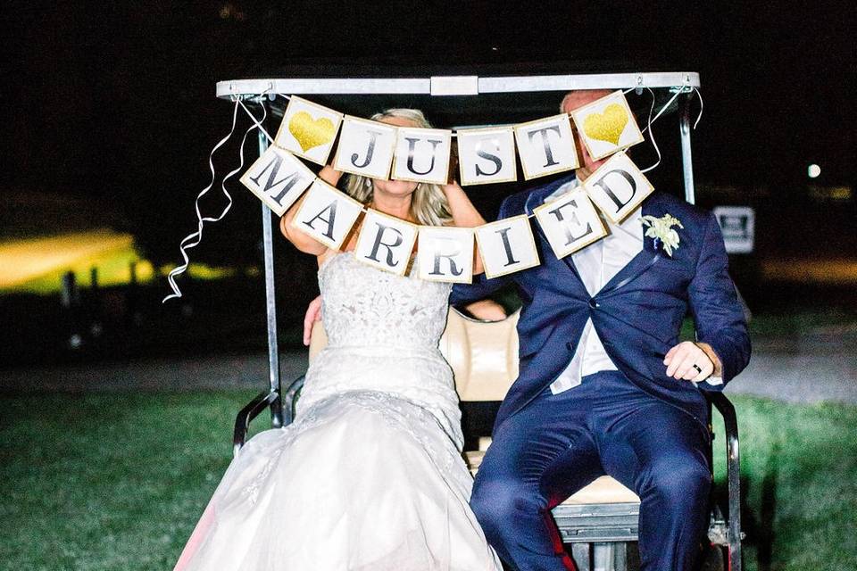 Bride & groom exit golf cart