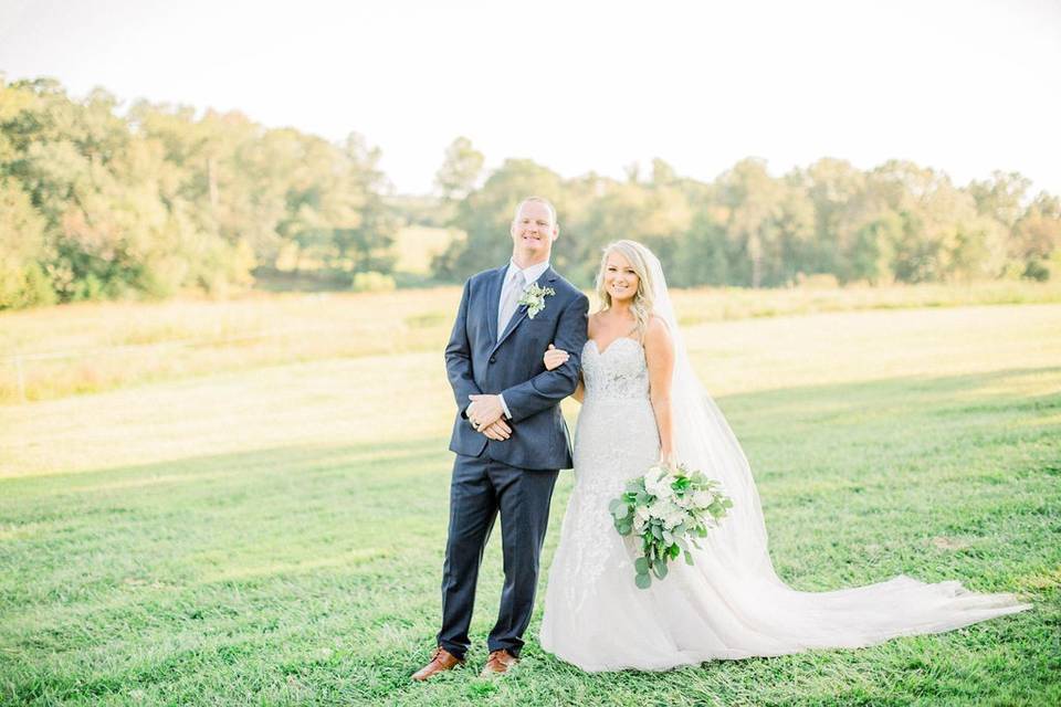 Bride and groom on grass