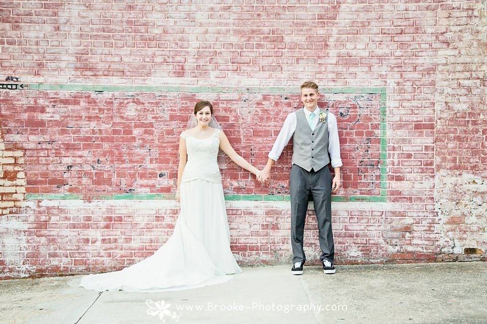 Bride and groom-brick wall