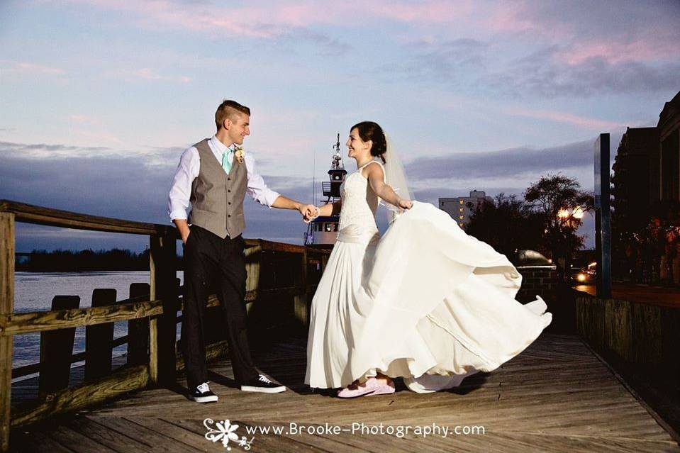 Bride and groom dancing-dock