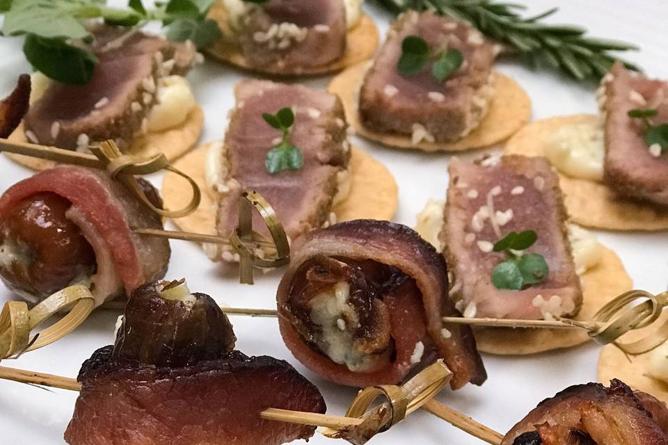 Bacon wrapped dates + ahi tuna canapes | Forks & Corks Catering