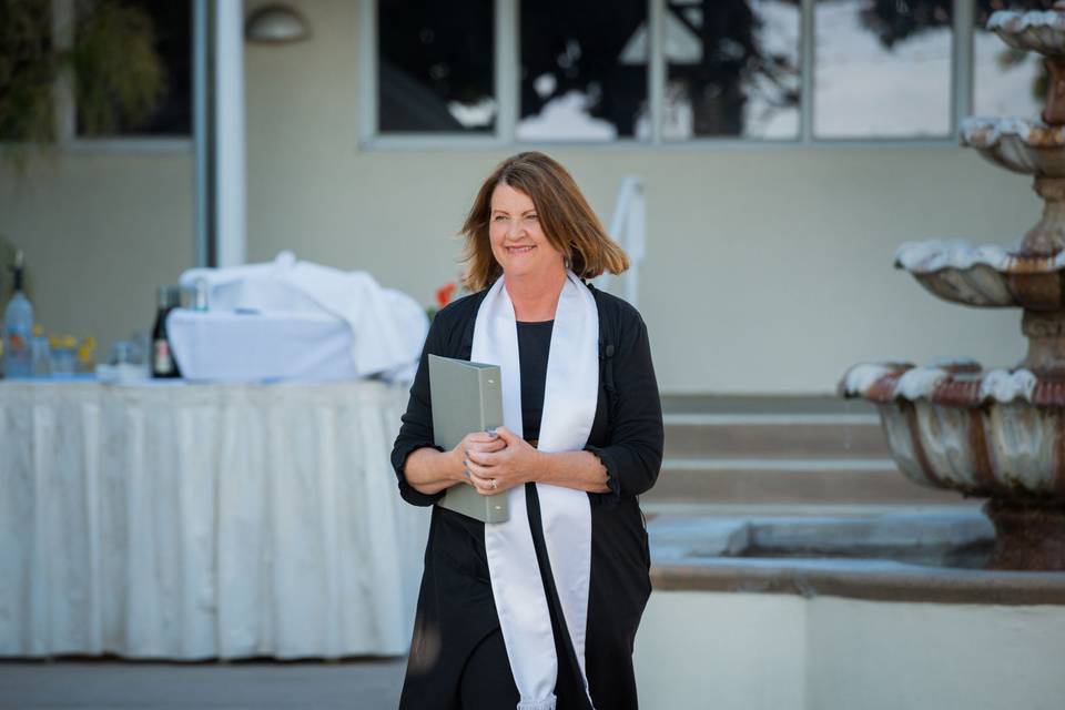 Stepping down the stairs to perform a ceremony at chaminade resort and spa