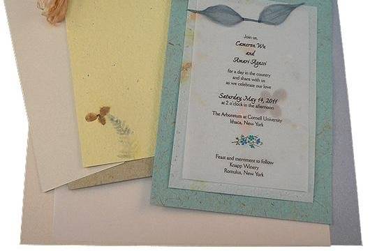 100% recycled handmade double panel wedding invitation DIY kit includes handmade recycled paper panels, eco-friendly vellum, ribbon, recycled reply card, printing templates and instructions. Option for plantable seed paper available!