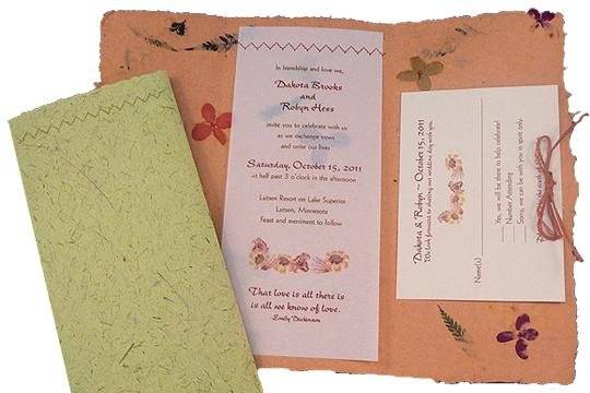 100% recycled handmade fold-up wedding invitations in orange and sandstone with recycled vellum inset and orange raffia bow. Custom calligraphy services, plantable seed paper and DIY Kit available!