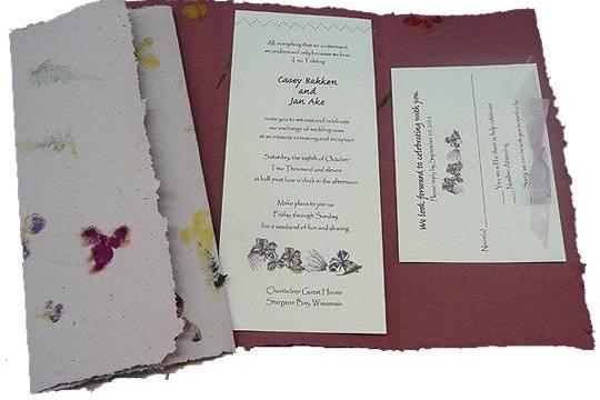 100% recycled handmade fold-up invitations in lavender and burgundy with cardstock inlay and lavender bow. Custom calligraphy services, plantable seed paper and DIY Kit available!