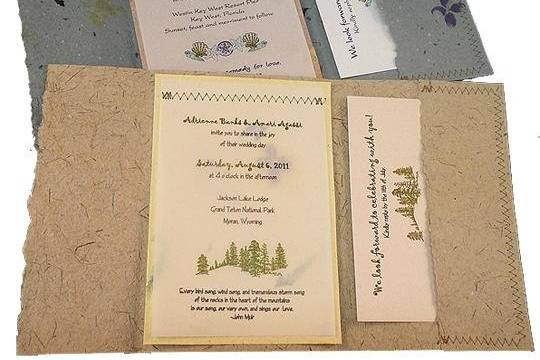 100% recycled handmade pocket wedding invitations in smoky blue with tan and recycled vellum panel, and sagebrush with yellow and recycled vellum panel. Custom calligraphy service, plantable seed paper and DIY Kit available!