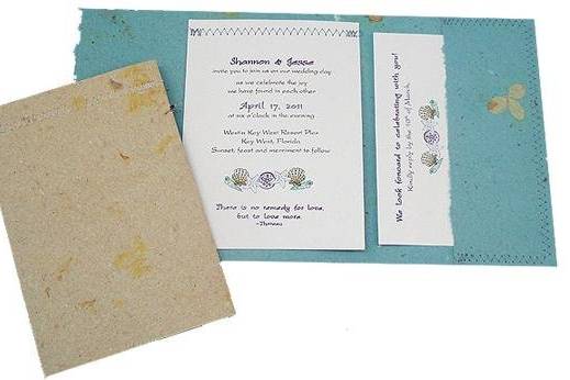 100% recycled handmade pocket wedding invitations in smoky blue with cardstock panel and tan. Custom calligraphy service, plantable seed paper and DIY Kit available!