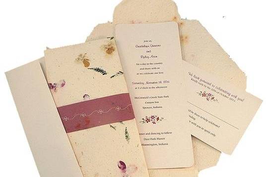 100% recycled handmade wrap wedding invitation in cream with burgundy seal and flower stitch. Custom calligraphy service, plantable seed paper and DIY Kit available!