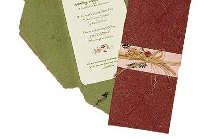 100% recycled handmade wrap wedding invitation. Spring green and olive interiors, granite exterior with pink wrap and natural raffia tie. Custom calligraphy service, plantable seed paper and DIY Kit available!