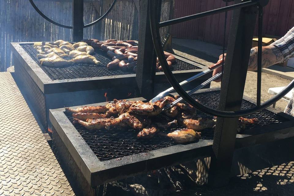 Chicken and sausage grilling