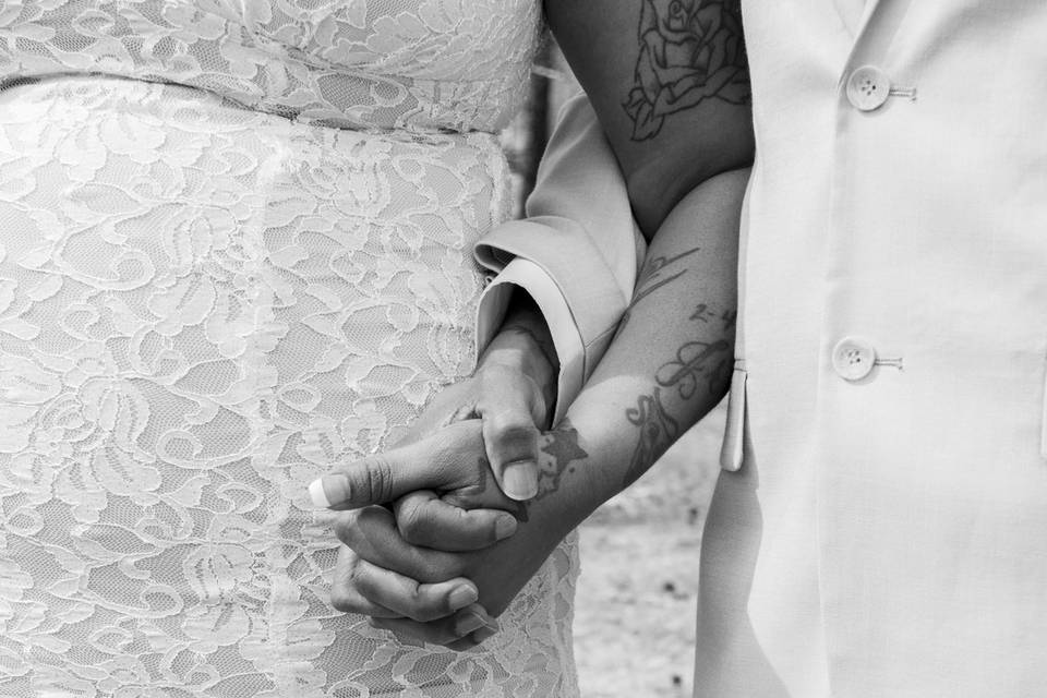 Bride and groom holding hands