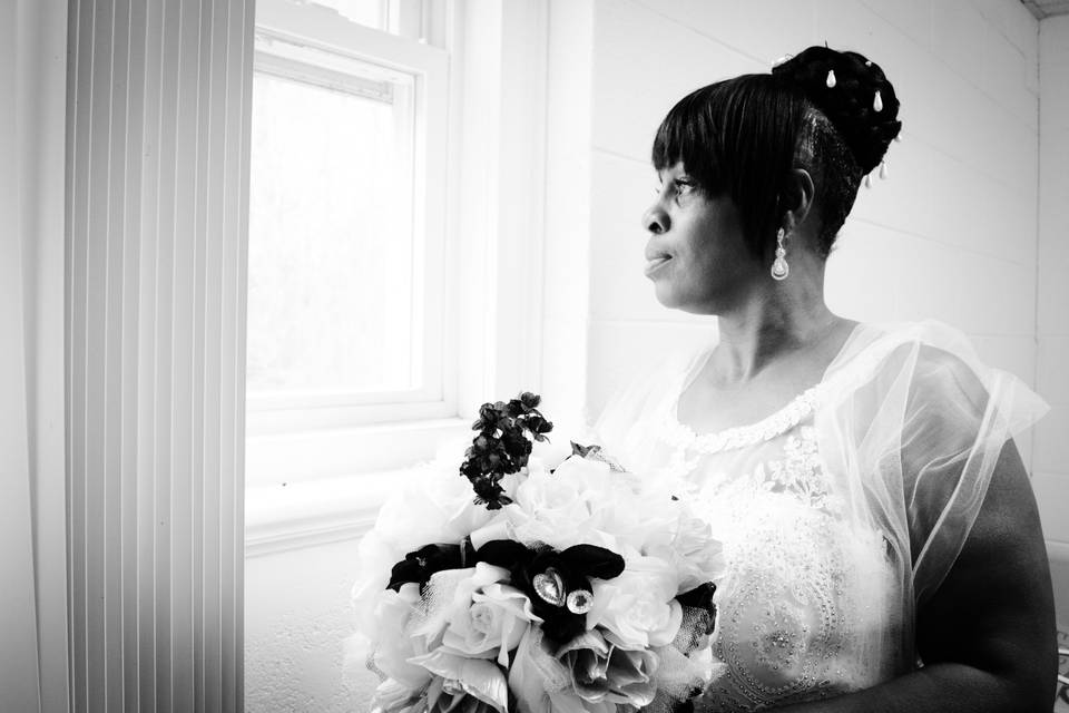 Bride looking out the window