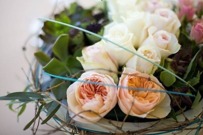 A table centerpiece in garden Roses and Succulents