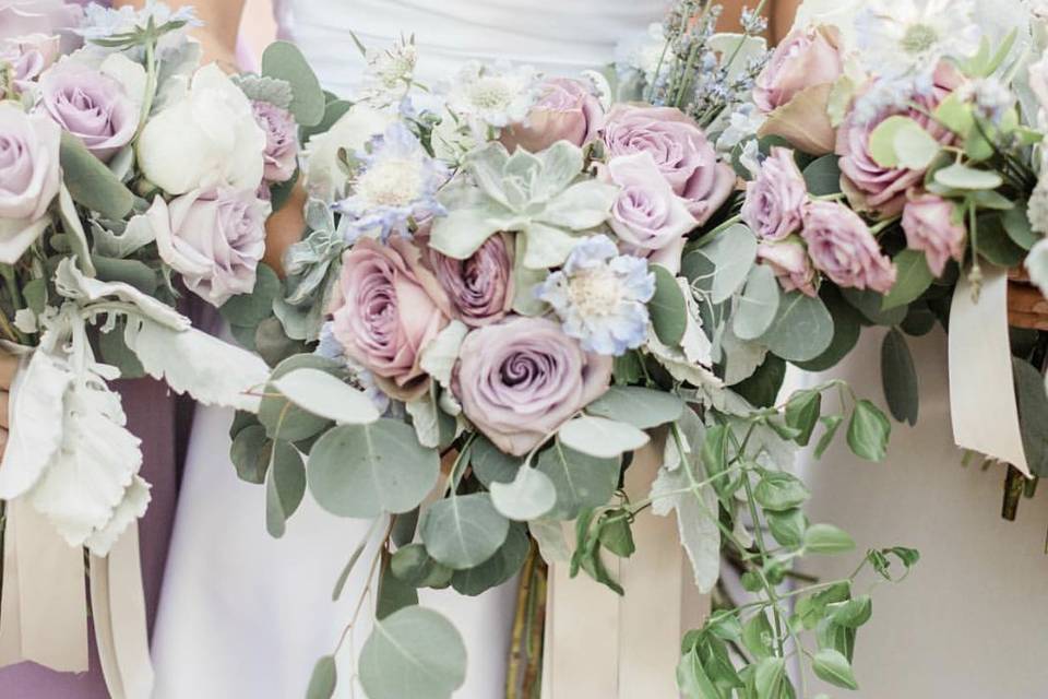 Soft lilacs and grays in these bouquets.