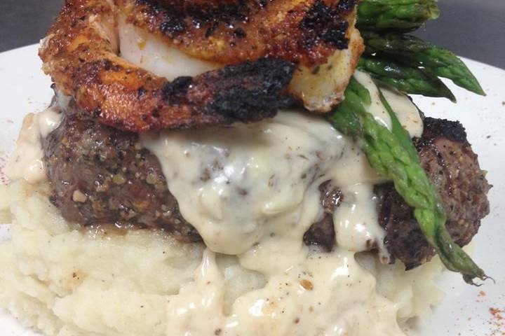 Filet topped with Blackened Jumbo Scallops and Shrimp with Newburg Sauce served with Mashed Potatoes and Asparagus
