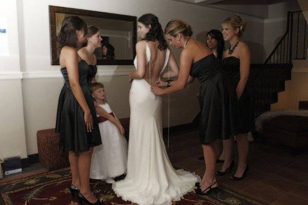 Bride with Bridesmaids. Getting Ready for Ceremony.