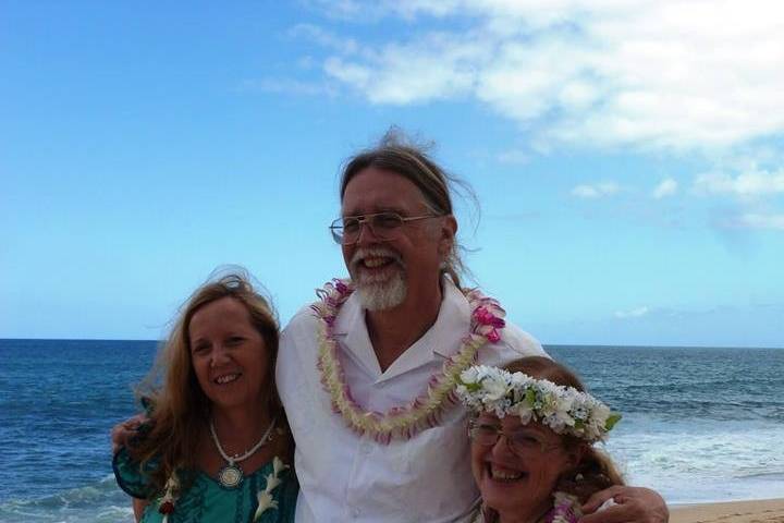 Posing with the wedding officiant