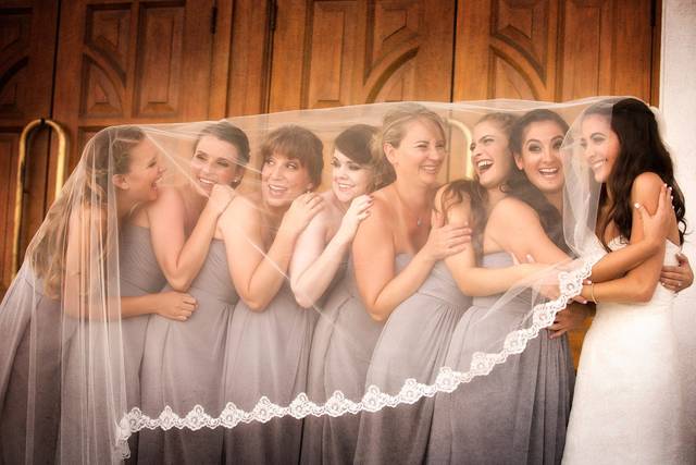 Bridesmaids under veil