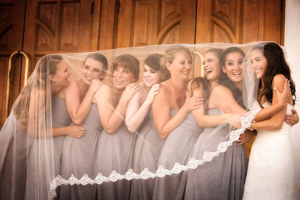 Bridesmaids under veil