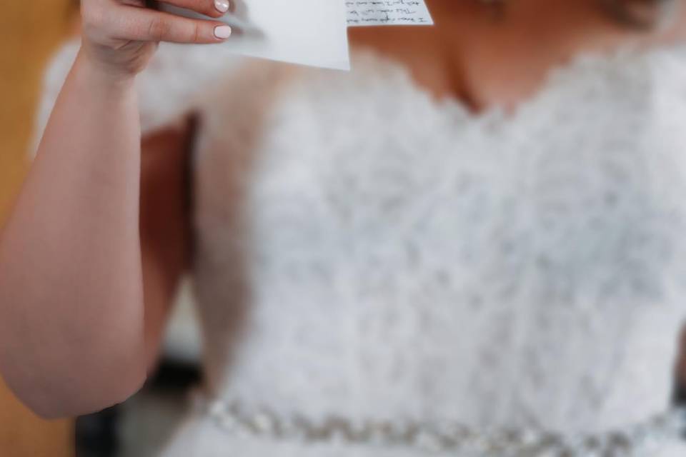 Bride reading emotional letter