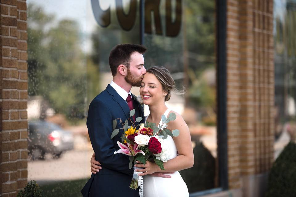 Groom kissing bride