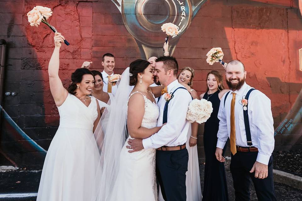 Bridal party in front of mural