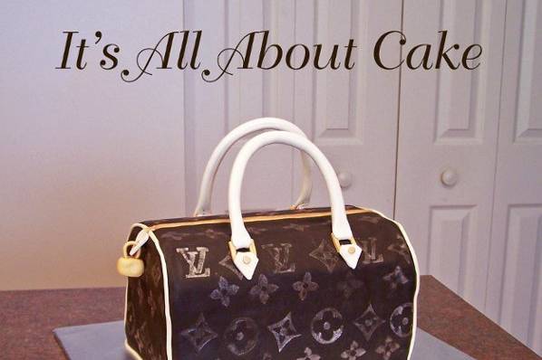 Louis Vuitton Hand Bag Sitting On Louis Vuitton Box Cake