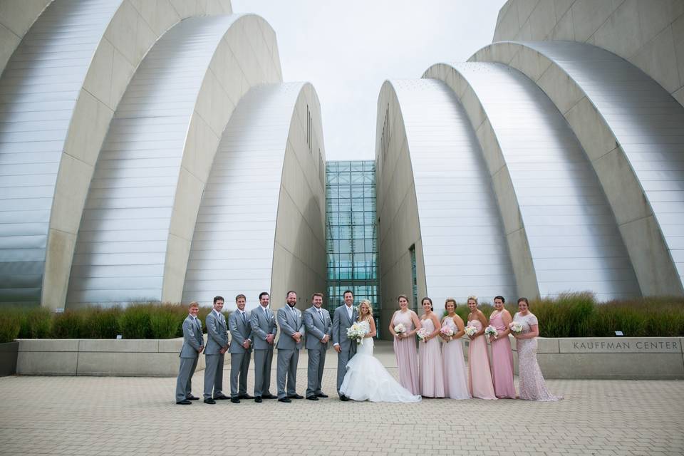 Kauffman Center for the Performing Arts Wedding Party Photos. Light pink bridesmaids dresses, gray tuxes. Downtown Kansas City wedding