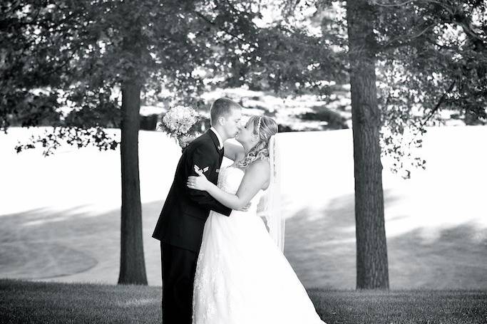 Groom kissing his bride