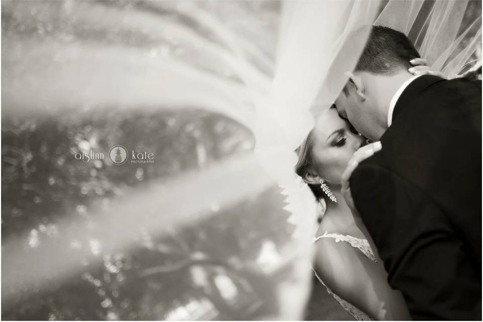 A kiss beneath the veil - Aislinn Kate Photography