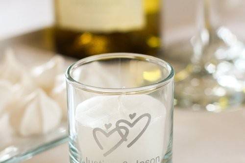 A candle with the couple's names and dates, add a removable tag to tell your guest where to sit! Great ideas for just about anything you can think of!