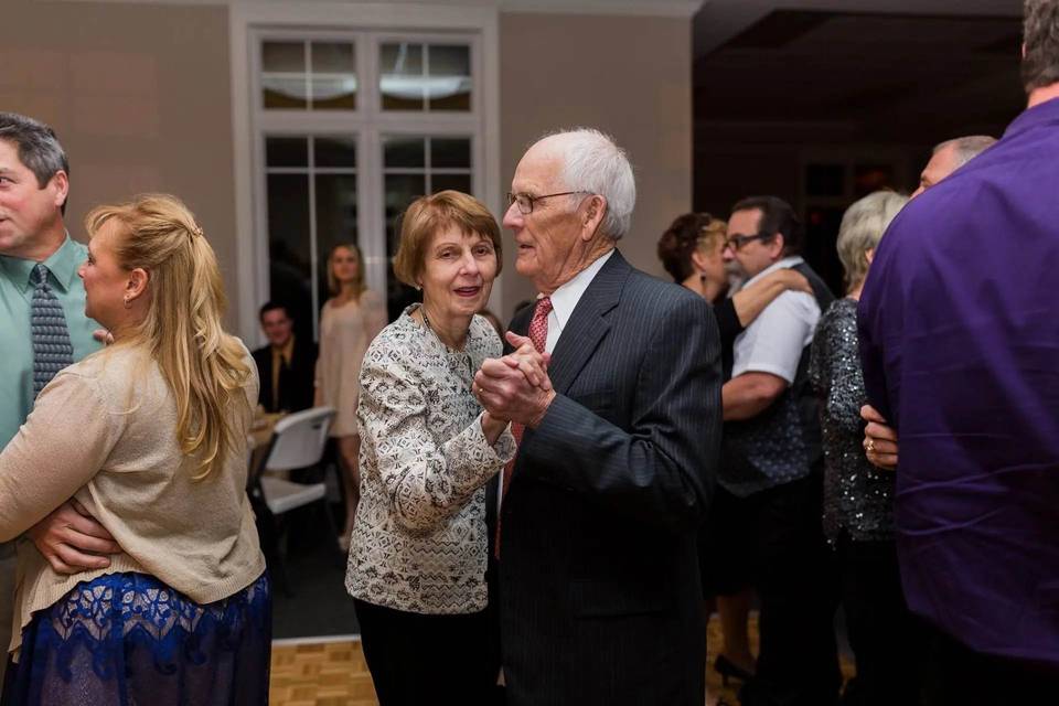 Happy people slow dancing.