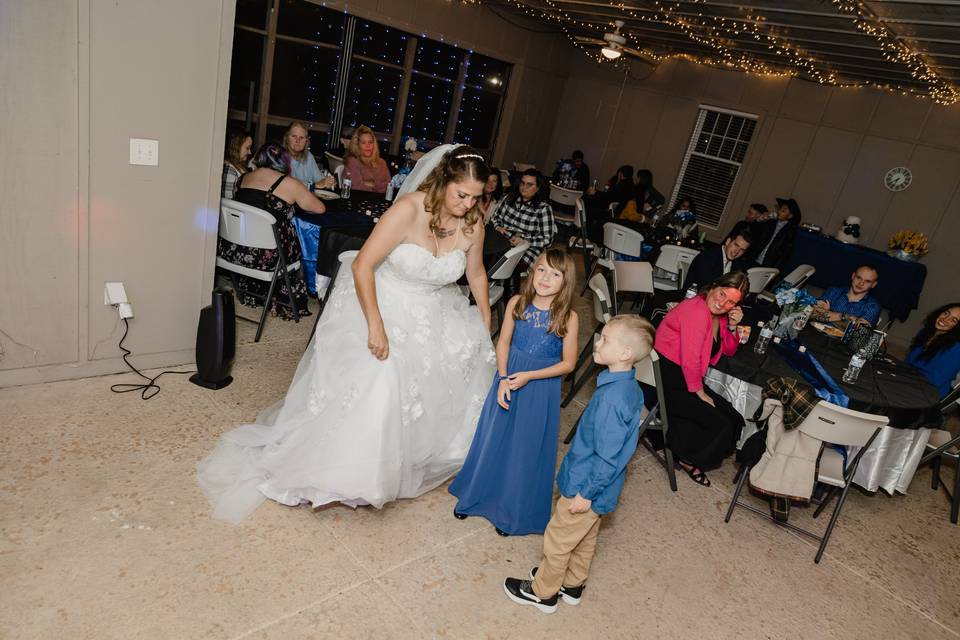 Bride and kids dancing