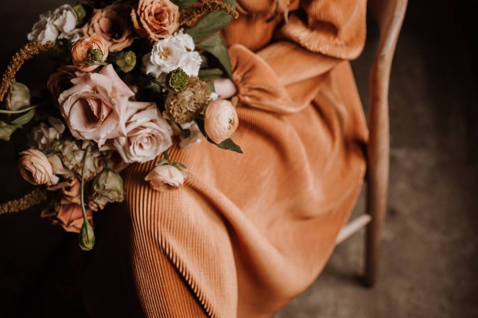 Girl sitting holding bouquet