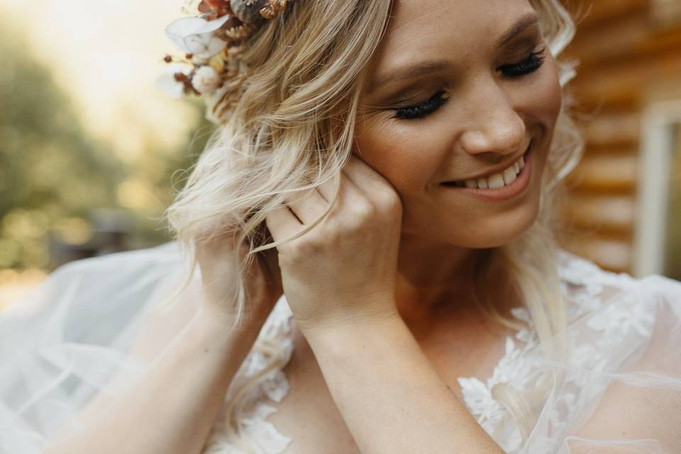 Bride putting in earrings