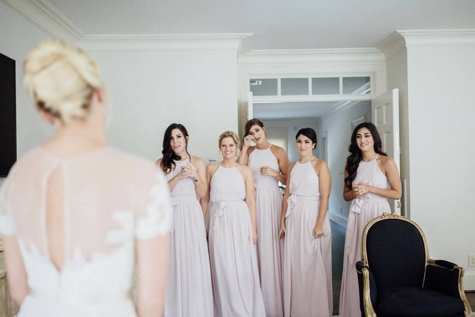 Bridesmaids' first look at the bride
