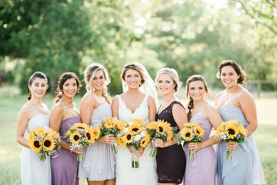 Bridal party and their sunflower bouquets