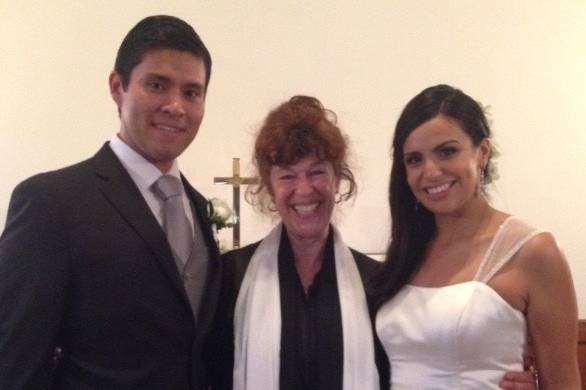 The newlyweds with the officiant