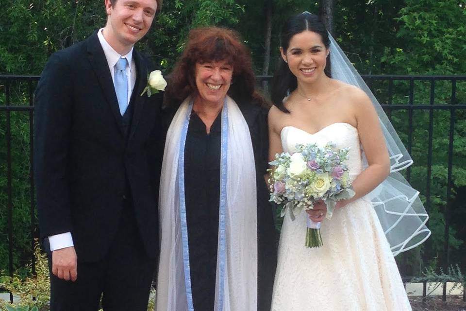 The groom, officiant and the bride