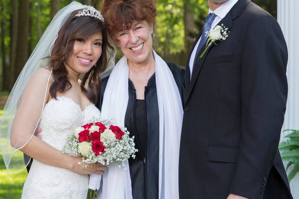 The officiant and the newlyweds