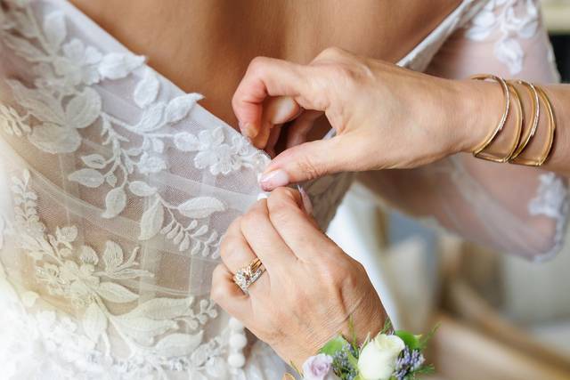 Mom dressing bride