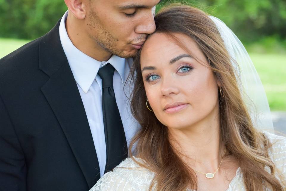 Groom kissing bride