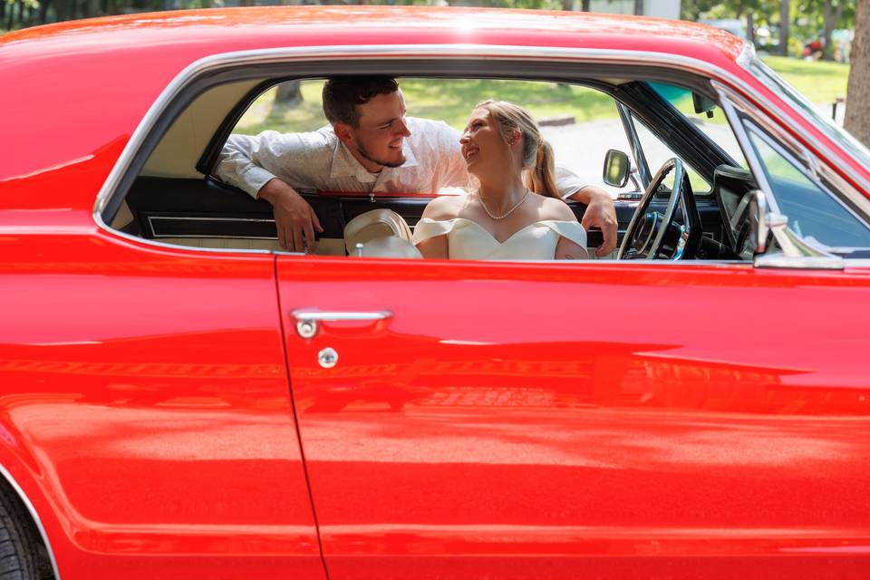 Bride and groom driving away