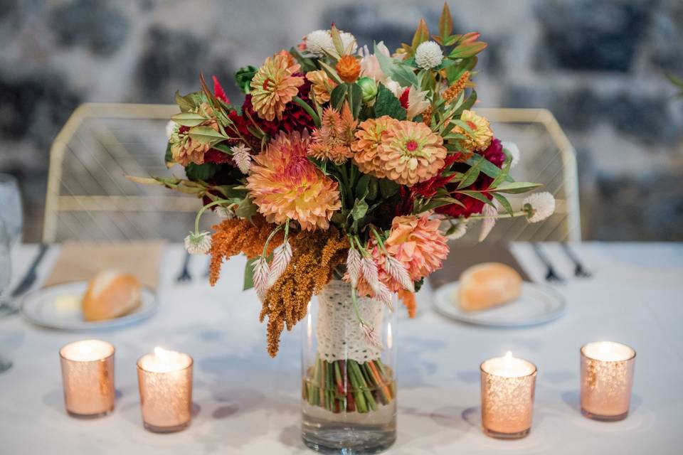 Warm-toned bouquet and candles