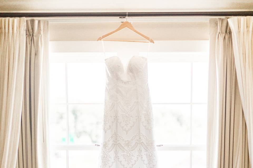 Wedding gown in front of window