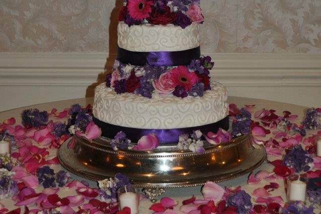 3-tier cake with violet ribbons